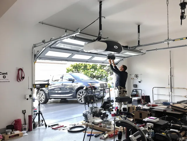 Seal Beach Garage Door Repair specialist installing smart garage door opener system in Seal Beach home